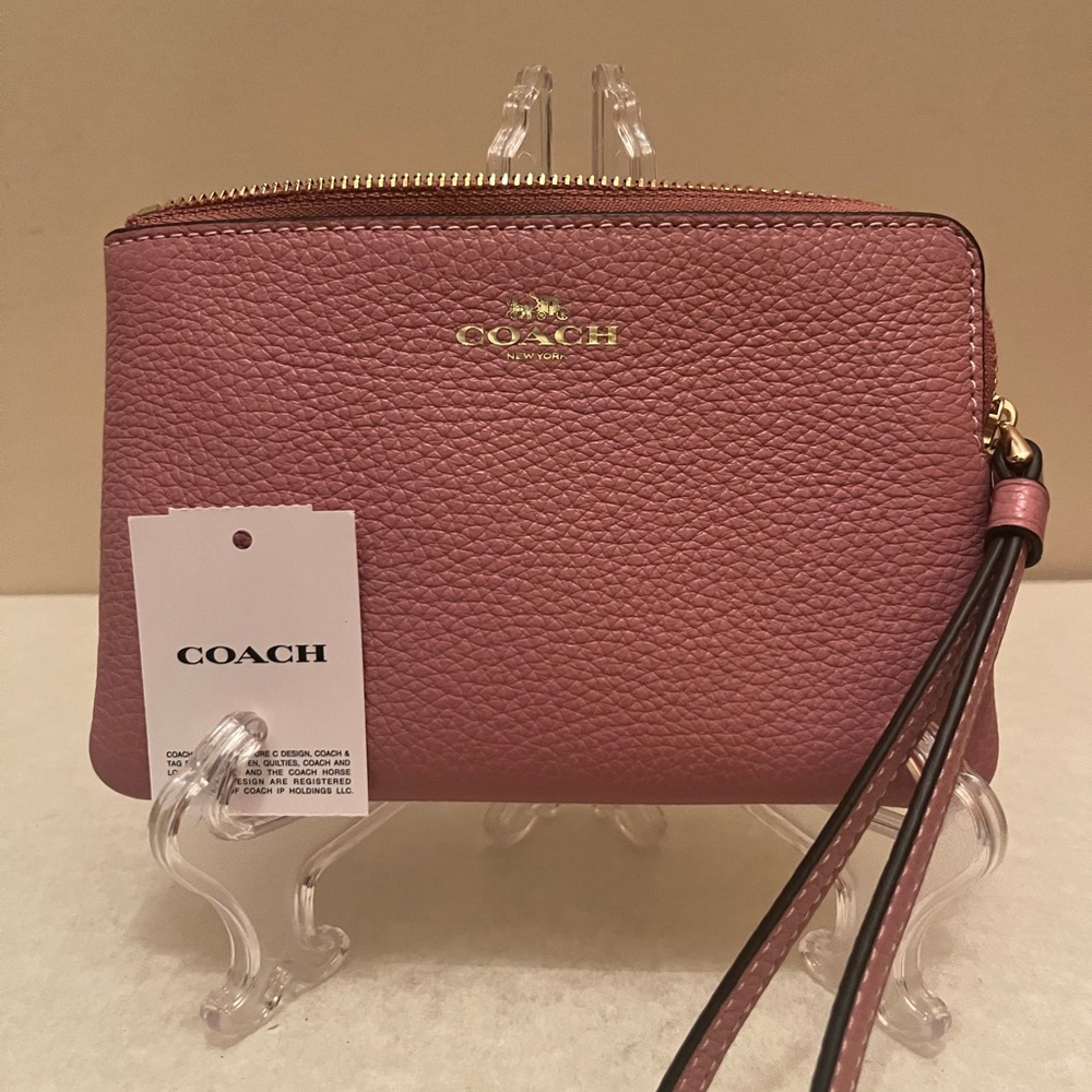 Brand new coach wristlet. Pebble pink color. Leather corner zip